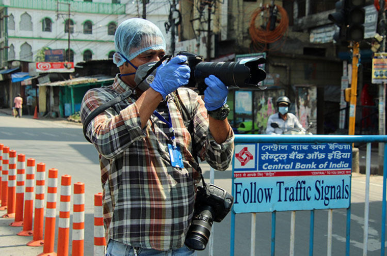 AFP photographer Diptendu Dutta works during a government-imposed nationwide lockdown as a preventive measure against the spread of COVID-19 in Siliguri, India, on April 10, 2020. (AFP)