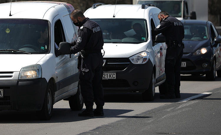 Police officers are seen in Sofia, Bulgaria, April 17, 2020. Police recently journalist Dimiter Petzov for alleged drug posession after searching his car. (Reuters/Stoyan Nenov)