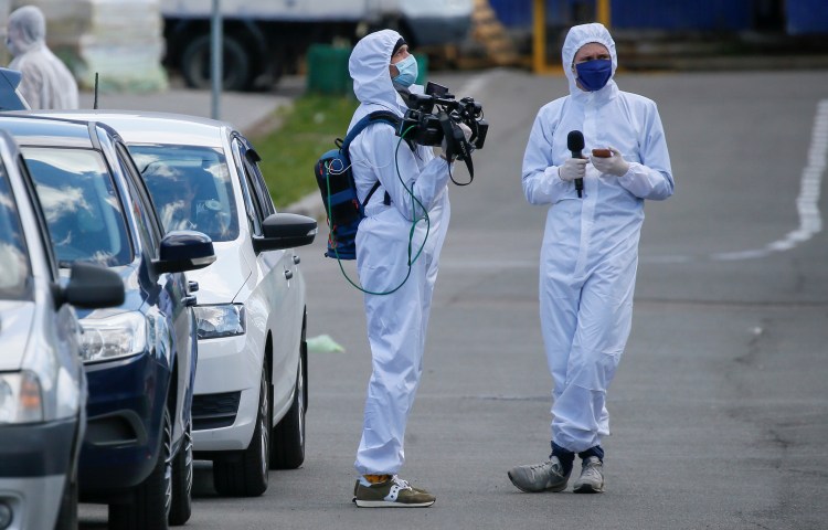 Journalists in protective gear