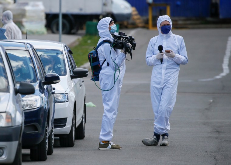 Journalists in protective gear