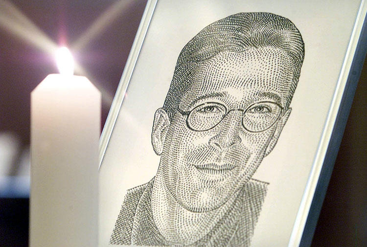 A portrait of slain Wall Street Journal reporter Daniel Pearl is seen in London on March 5, 2002. Pearl's family recently filed to uphold the convictions in the journalist's 2002 murder. (Reuters/Ian Waldie)