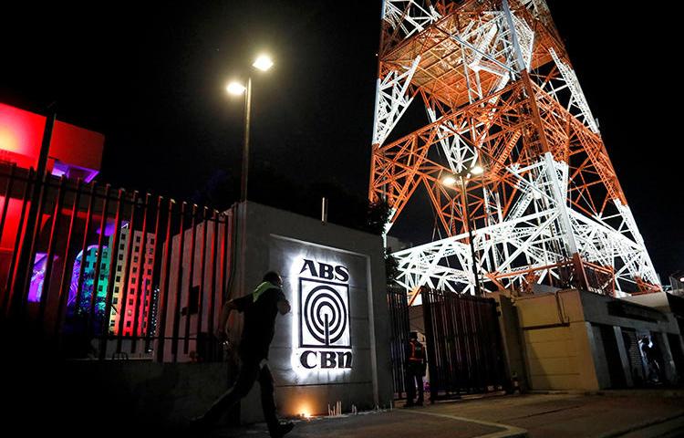 The ABS-CBN network headquarters, where candles are lit following government orders to cease its operations, is seen in Quezon City, Metro Manila, Philippines, on May 5, 2020. (AP/Eloisa Lopez)