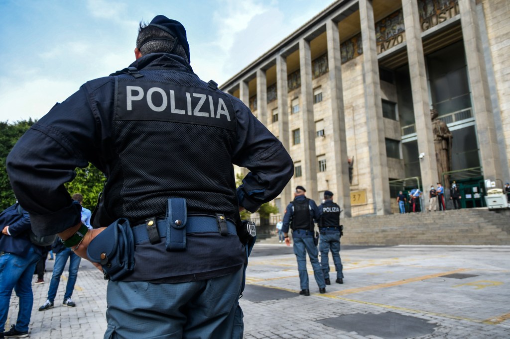 Police officers are seen in Italy in 2020.