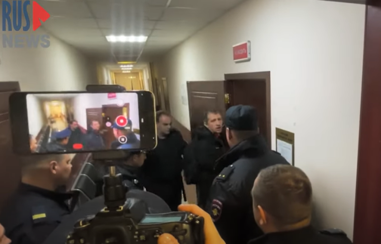 RusNews reporter Roman Ivanov walks into a court in Korolyov, Russia on April 12, 2023. The court ordered he be detained until June 10 on three charges of spreading fake information about the Russian army.