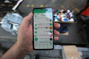 In this picture taken on April 19, 2023, a man shows the Iranian messaging app (Bale) on his mobile telephone in Tehran.