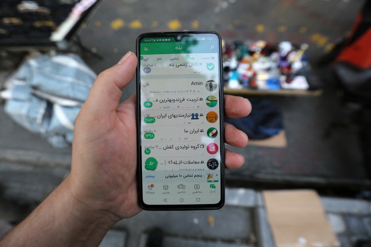 In this picture taken on April 19, 2023, a man shows the Iranian messaging app (Bale) on his mobile telephone in Tehran.
