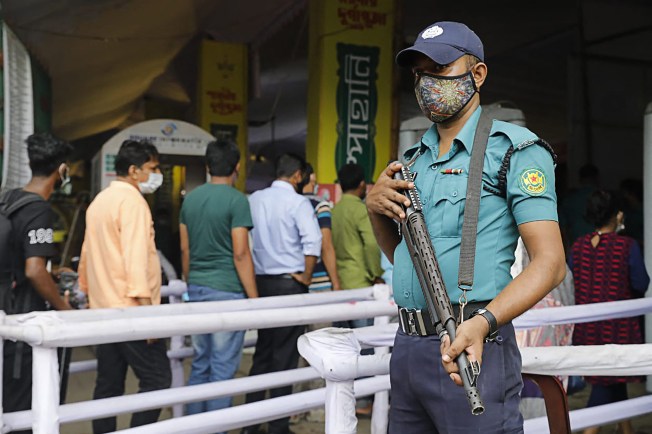A police officer is seen in Dhaka, Bangladesh, on October 14, 2021. (Sabina Yesmin/AFP)
