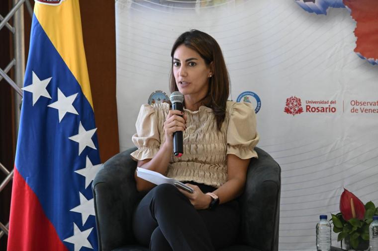 Estefanía Colmenares, editor of Colombia's La Opinión newspaper, speaks into a microphone