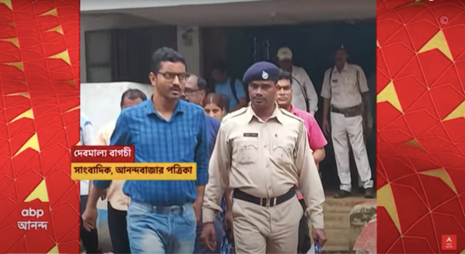 Debmalya Bagchi (left), a correspondent with India's Ananda Bazar Patrika newspaper, is arrested on September 6, 2023. (Photo Credit: TK)