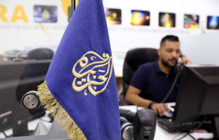 An employee on the phone inside the office of the Qatar-based Al-Jazeera network in Jerusalem on August 7, 2017.