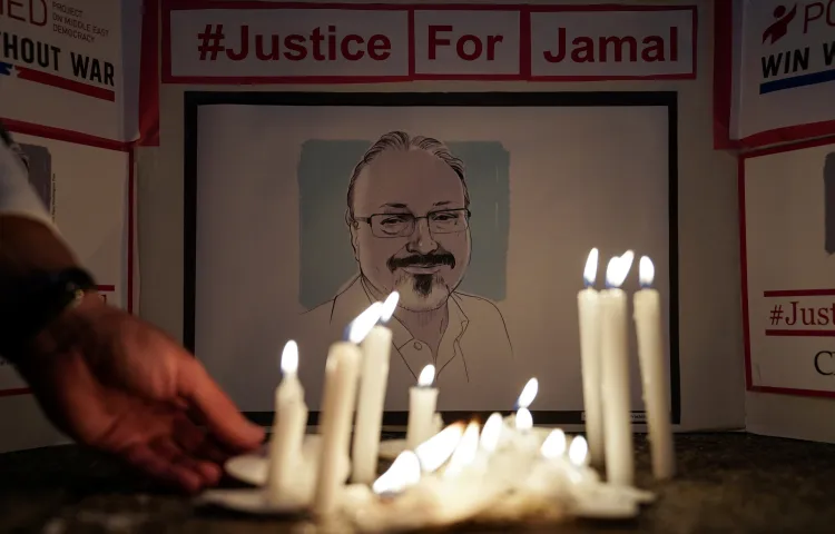 Press freedom activists hold a candlelight vigil in front of the Saudi Arabian embassy in Washington, D.C. to mark the first anniversary of the 2018 murder of journalist Jamal Khashoggi. (Reuters/Sarah Silbiger)