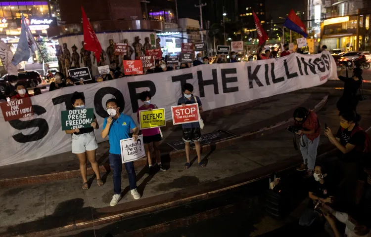 People call for the protection of media workers at a rally following the killing of Filipino radio journalist Percival Mabasa, in Quezon City, Philippines, on October 4, 2022.
