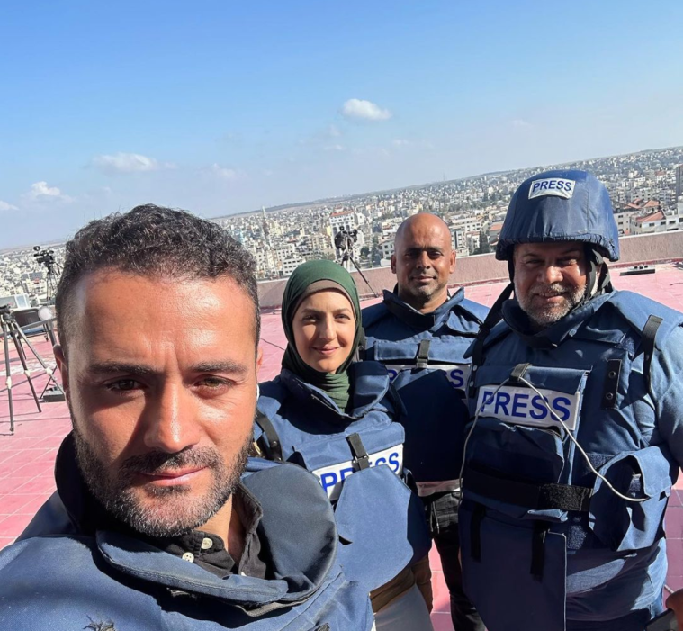 Journalists Hamdan Dahdouh, Youmna Al-Sayed, and Wael Al Dahdouh in Gaza, on October 31, 2023.