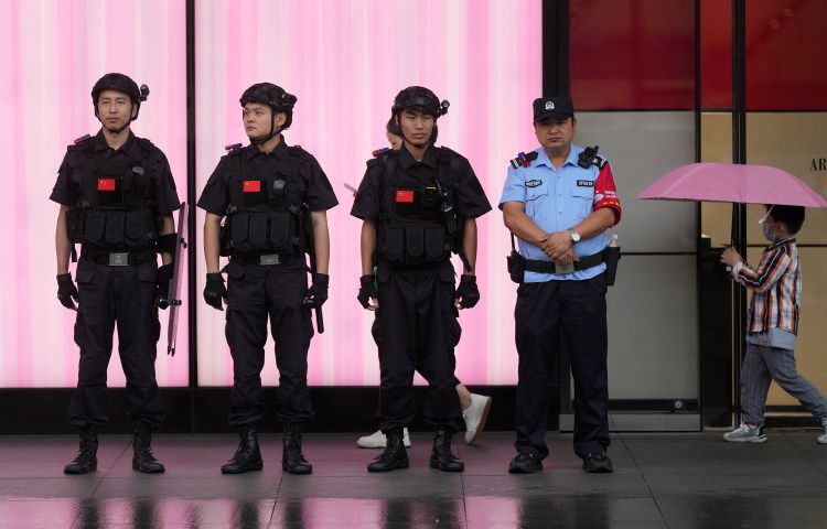 Chinese police officers outside West Lake in Hangzhou, China, on September 22, 2023.