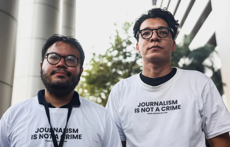 Thai reporter Nattaphol Meksobhon (left) and photographer Nattaphon Phanphongsanon are seen after receiving bail in Bangkok, Thailand, on February 13, 2024.