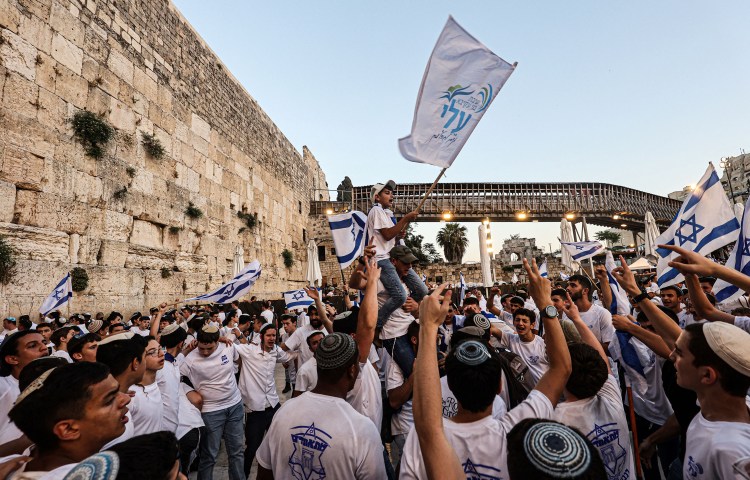 Israeli nationalists, including far-right activists, shout and dance at the Western Wall in the Old City of Jerusalem on June 5, 2024, during the Jerusalem Day Flag March. (Photo: AFP/Gil Cohen-Magen)
