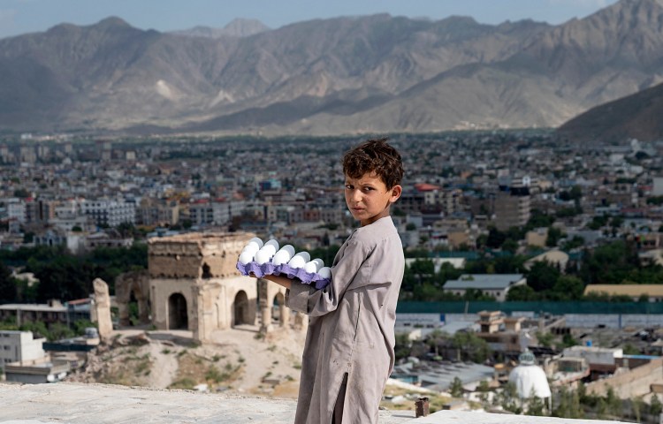 An Afghan boy selling eggs in Kabul on June 3.