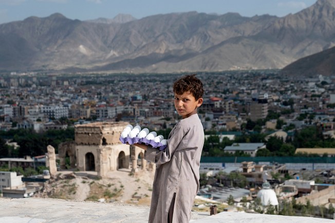 An Afghan boy selling eggs in Kabul on June 3.