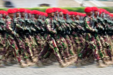 Soldiers march during a parade marking the 78th anniversary of the Indonesian Armed Forces in Jakarta on October 5, 2023. Indonesian journalist Sempurna Pasaribu and three family members died in a house fire days after Pasaribu published reports alleging high-level military involvement in an illegal gambling operation. (AP Photo/Tatan Syuflana)
