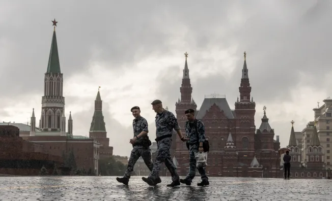 Russian law enforcement officers walk in the Red Square during stormy weather in Moscow on June 20, 2024. (Photo: Reuters/Maxim Shemetov)