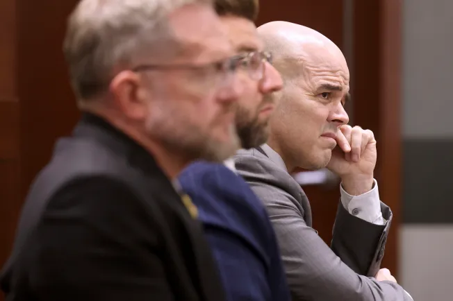 In this file image, Robert Telles (right), a former Clark County public administrator charged in the murder of investigative journalist Jeff German, listens to closing arguments during his murder trial in Las Vegas, on August 26, 2024.