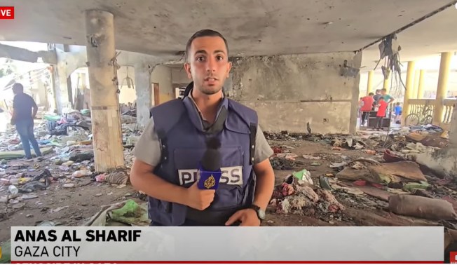 Al Jazeera's Anis Al Sharif reports from inside the school that was hit in an Israeli attack on August 10, 2024, killing more than 100 people. CPJ issued a statement expressing concern for his safety after the Israel Defense Forces accused him of "presenting a lie" in his coverae of the strike. https://cpj.org/2024/08/cpj-concerned-about-safety-of-al-jazeera-gaza-correspondent-anas-al-sharif/ (Screenshot: YouTube/Al Jazeera)