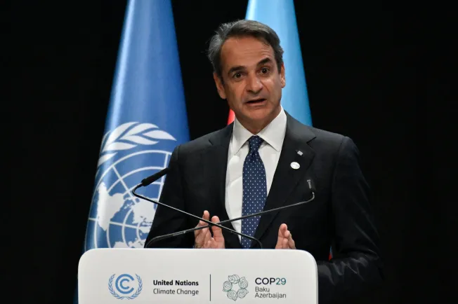 Greek Prime Minister Kyriakos Mitsotakis speaks during the United Nations Climate Change Conference in Baku on November 13, 2024. CPJ joined six other international press freedom organizations in condemning legal actions against Greek journalists filed by Grigoris Dimitriadis, former general secretary and the nephew of Mitsotakis. (Photo: AFP/Alexander Nemenov)