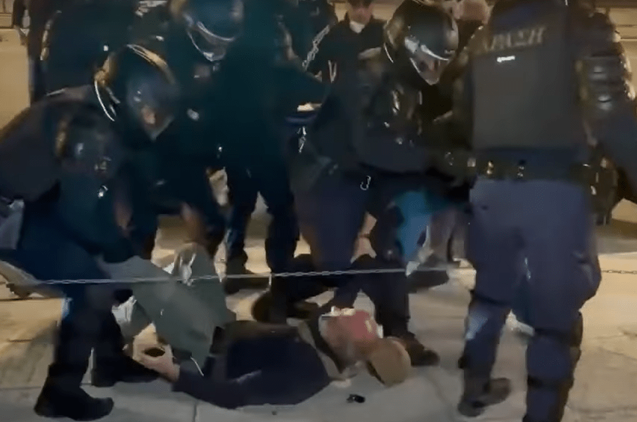 Riot police drag Giorgos Androutsou along the ground during a protest by firefighters in the capital Athens on October 31, 2024.