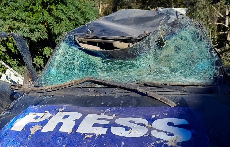 A damaged car marked with 'Press' at the site of an Israeli strike that killed a few journalists and wounded several others as they slept in guesthouses used by media in Hasbaya in southern Lebanon on October 25, 2024