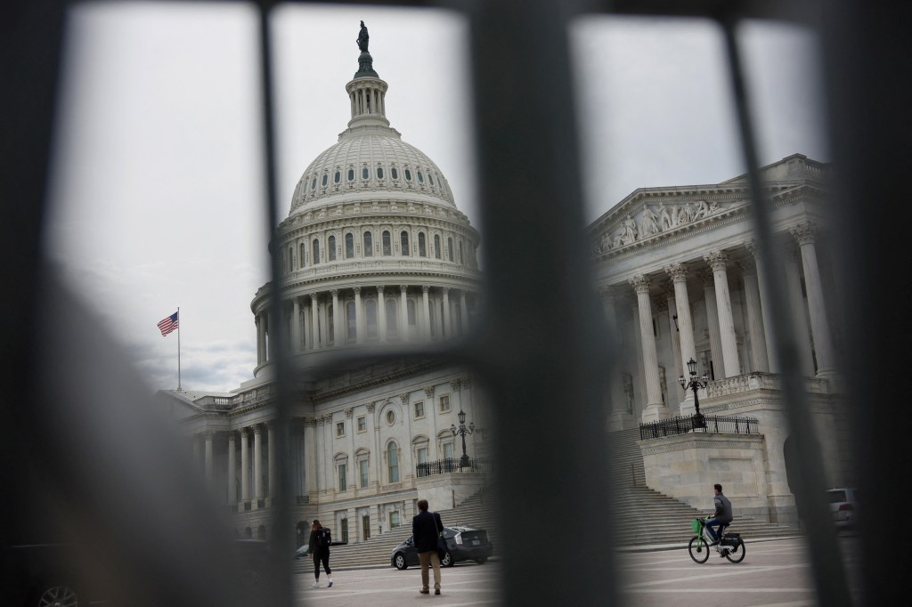 The U.S. Capitol building viewed through the bars of standard barricades in Washington, U.S., April 4, 2025. (Photo: Reuters/Leah Millis)