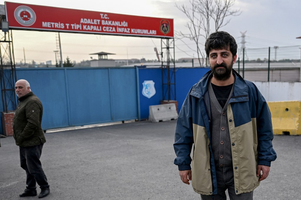 AFP photographer Yasin Akgul stands outside the Metris Prison after his release in Istanbul on March 27.