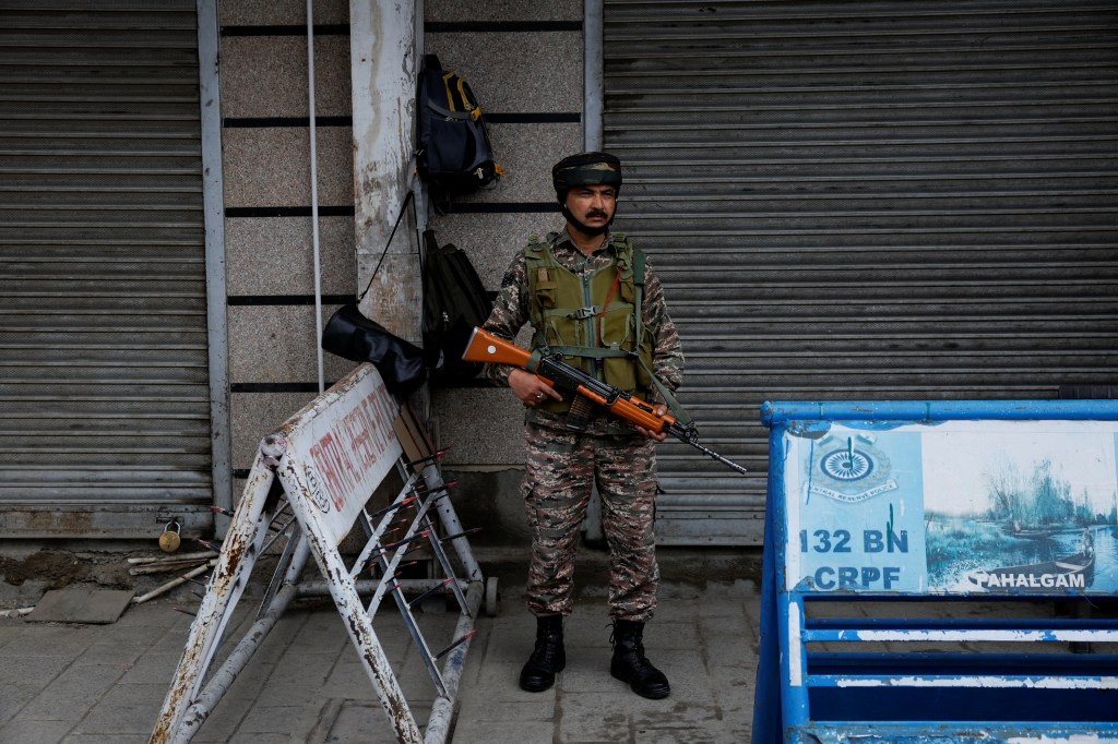 An Indian security personnel stands guard on a street, following clashes between India and Pakistan, in Srinagar, Kashmir May 9, 2025.
