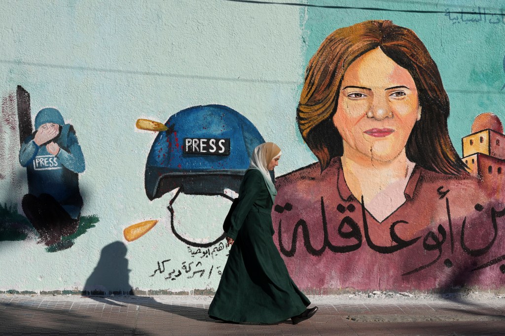 A mural of slain of Al Jazeera journalist Shireen Abu Akleh on a wall in Gaza City in 2022.