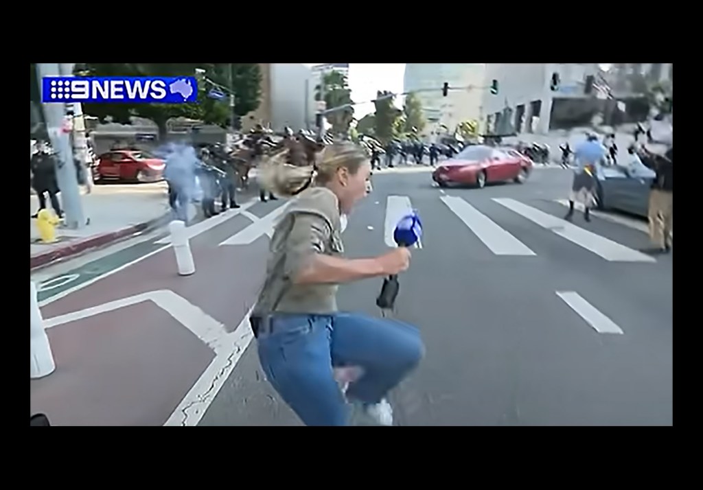 Australian reporter Lauren Tomasi, of 9News, is hit by a rubber bullet on Sunday while covering protests in Los Angeles. (Screenshot: 9News-ITV News/You Tube)
