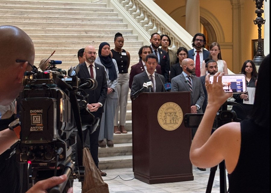CPJ Regional Director José Zamora speaks at a Georgia news conference on July 22, with Mario Guevara's lawyer, Giovanni Diaz, to his right, and the journalist's daughter, Katherine Guevara on the far right.