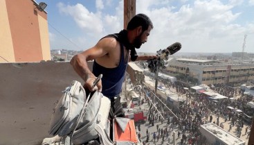 A man holds the equipment used by Palestinian camera operator Hussam Al-Masri, a contractor for Reuters, at the site where he was killed along with other journalists and people in Israeli strikes on Nasser hospital, in Khan Yunis on, August 25, 2025. (Photo: Reuters/Hatem Khaled)