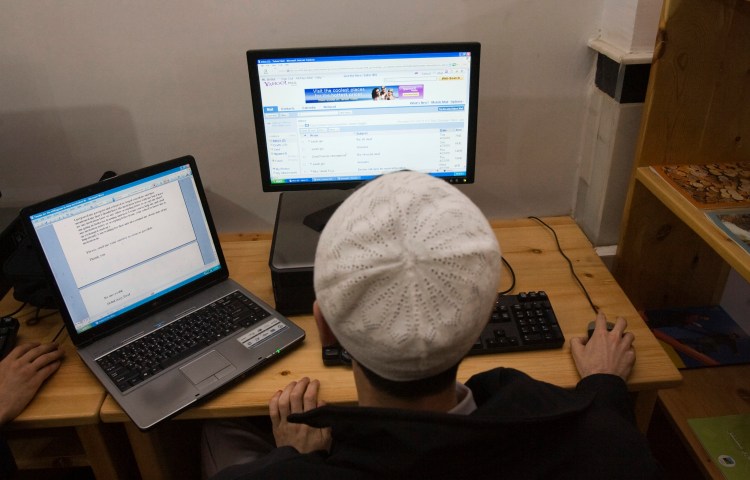 An Afghan man uses the internet at the Lincoln U.S. support library in Herat December 13, 2009.