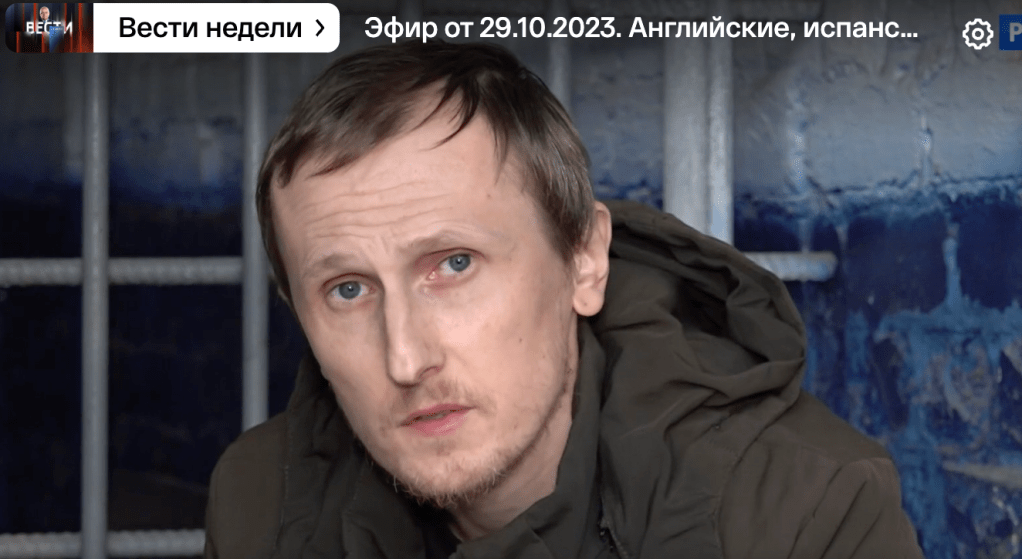 Ukrainian journalist Heorhiy Levchenko is seen behind bars after his arrest in August 2023.
