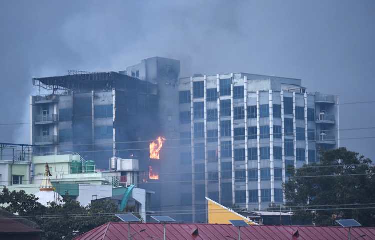 The office of Nepal's Kantipur Media Group’s is seen on fire in Kathmandu.