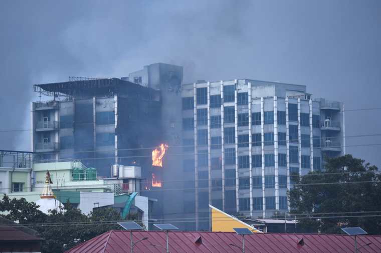 The office of Nepal's Kantipur Media Group’s is seen on fire in Kathmandu.