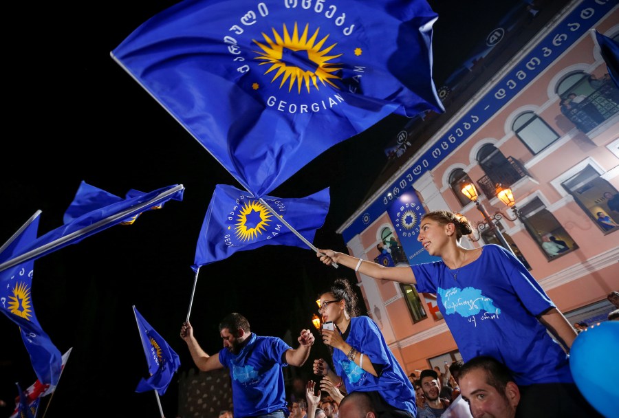 Restrictive laws on foreign funding are part of a sharp decline in press freedom under the Georgian Dream party, whose flags are seen here.