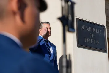 U.S. Defense Secretary Pete Hegseth salutes as he welcomes Qatar's Deputy Prime Minister and Minister of Defense Sheikh Saoud bin Abdulrahman al-Thani at the Pentagon in Washington, D.C., U.S., October 10, 2025. REUTERS/Ken Cedeno