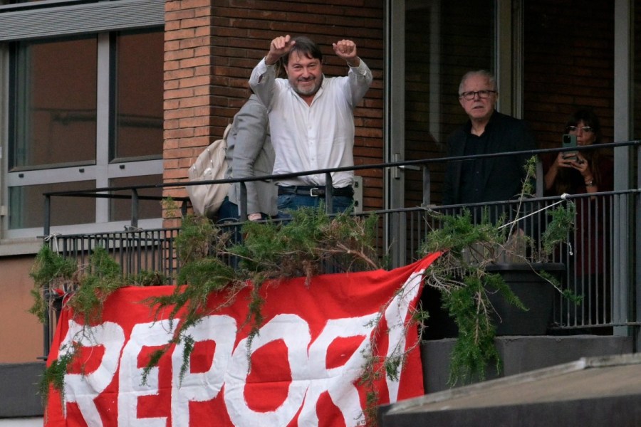 Investigative journalist Sigfrido Ranucci waves to supporters from broadcaster RAI’s balcony in Rome the day after his car was bombed.