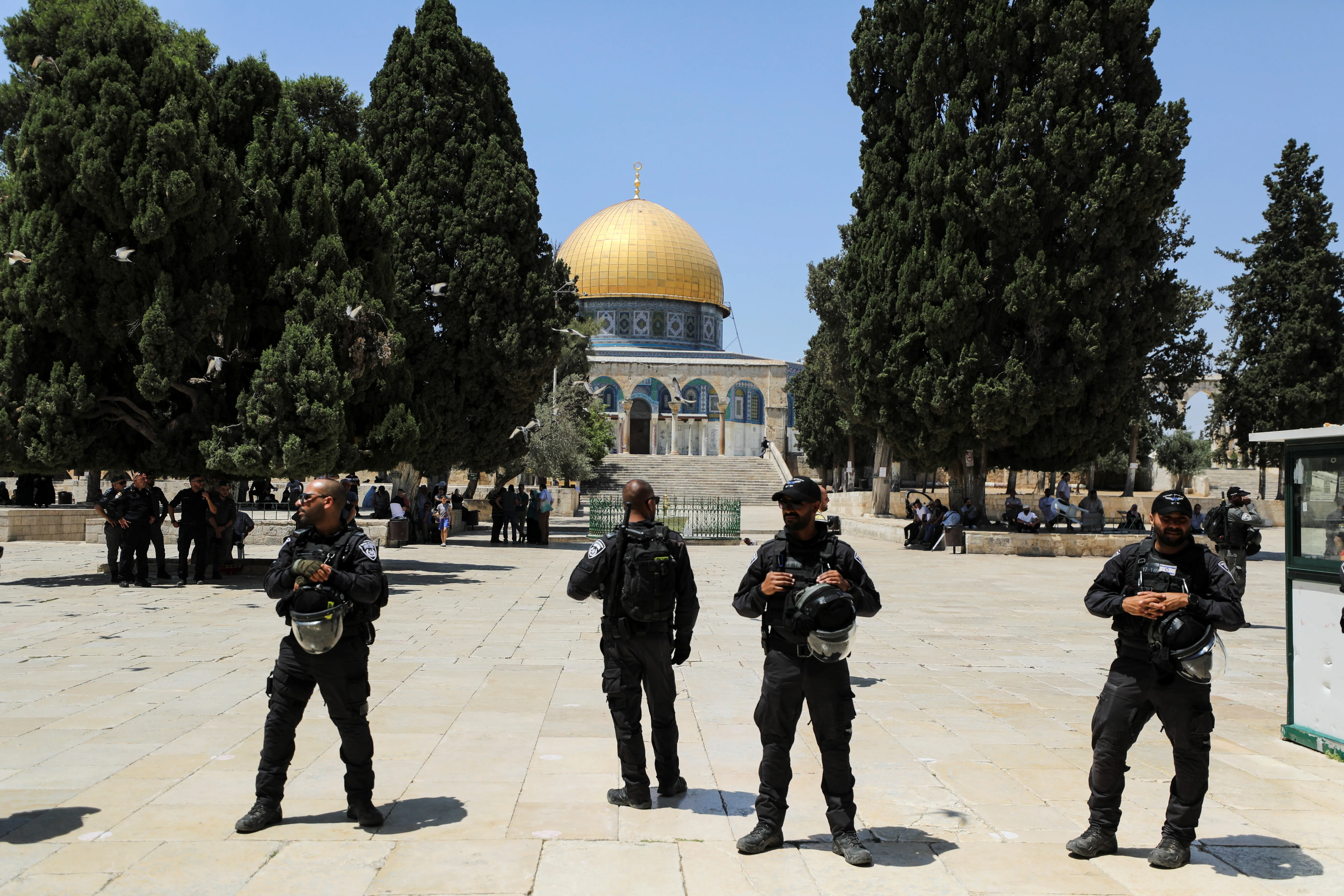 The Dome of the Rock is seen behind Israeli security forces after clashes between Israeli police and Palestinians at al-Aqsa Mosque over visits by Jews to the compound known to Muslims as Noble Sanctuary and to Jews as Temple Mount, in Jerusalem's Old City in 2021.