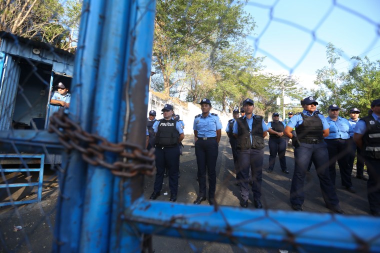 Nicaraguan police face protesters outside a notorious detention center in 2018.