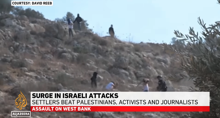 Israeli settlers attack Palestinians, activists, journalists near Nablus in the West Bank on November 8, 2025. 