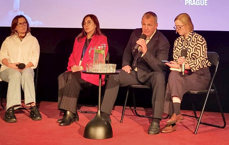 Journalist Vladyslav Yesypenko (second from right) and Gulnoza Said, CPJ’s Europe and Central Asia program coordinator (second from left), join other guests at an October 2025 panel in Prague on the plight of Ukrainian journalists in Russian captivity.