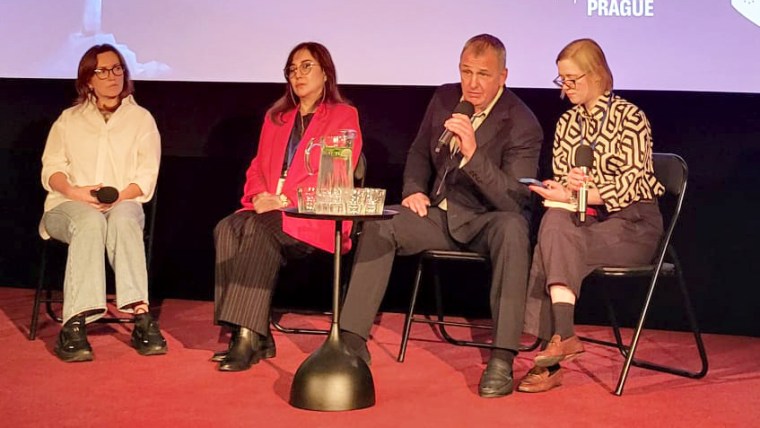 Journalist Vladyslav Yesypenko (second from right) and Gulnoza Said, CPJ’s Europe and Central Asia program coordinator (second from left), join other guests at an October 2025 panel in Prague on the plight of Ukrainian journalists in Russian captivity.