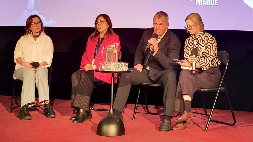 Journalist Vladyslav Yesypenko (second from right) and Gulnoza Said, CPJ’s Europe and Central Asia program coordinator (second from left), join other guests at an October 2025 panel in Prague on the plight of Ukrainian journalists in Russian captivity.