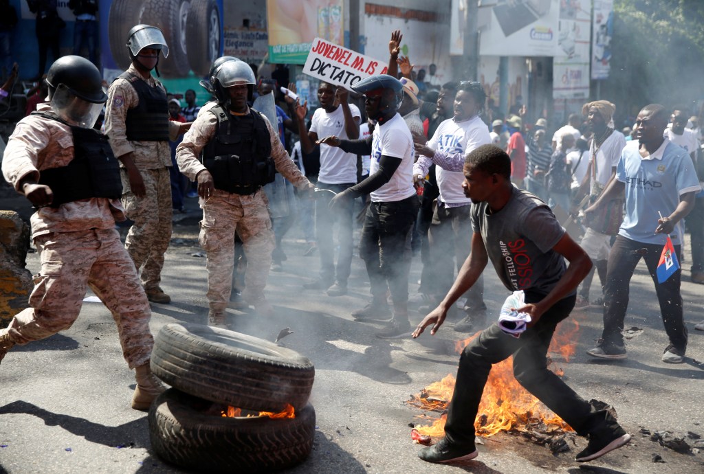 Demonstrators take to the streets in protest of Haiti’s President Jovenel Moïse, in Port-au-Prince, on February 14, 2021. (Photo: Reuters/Jeanty Junior Augustin)